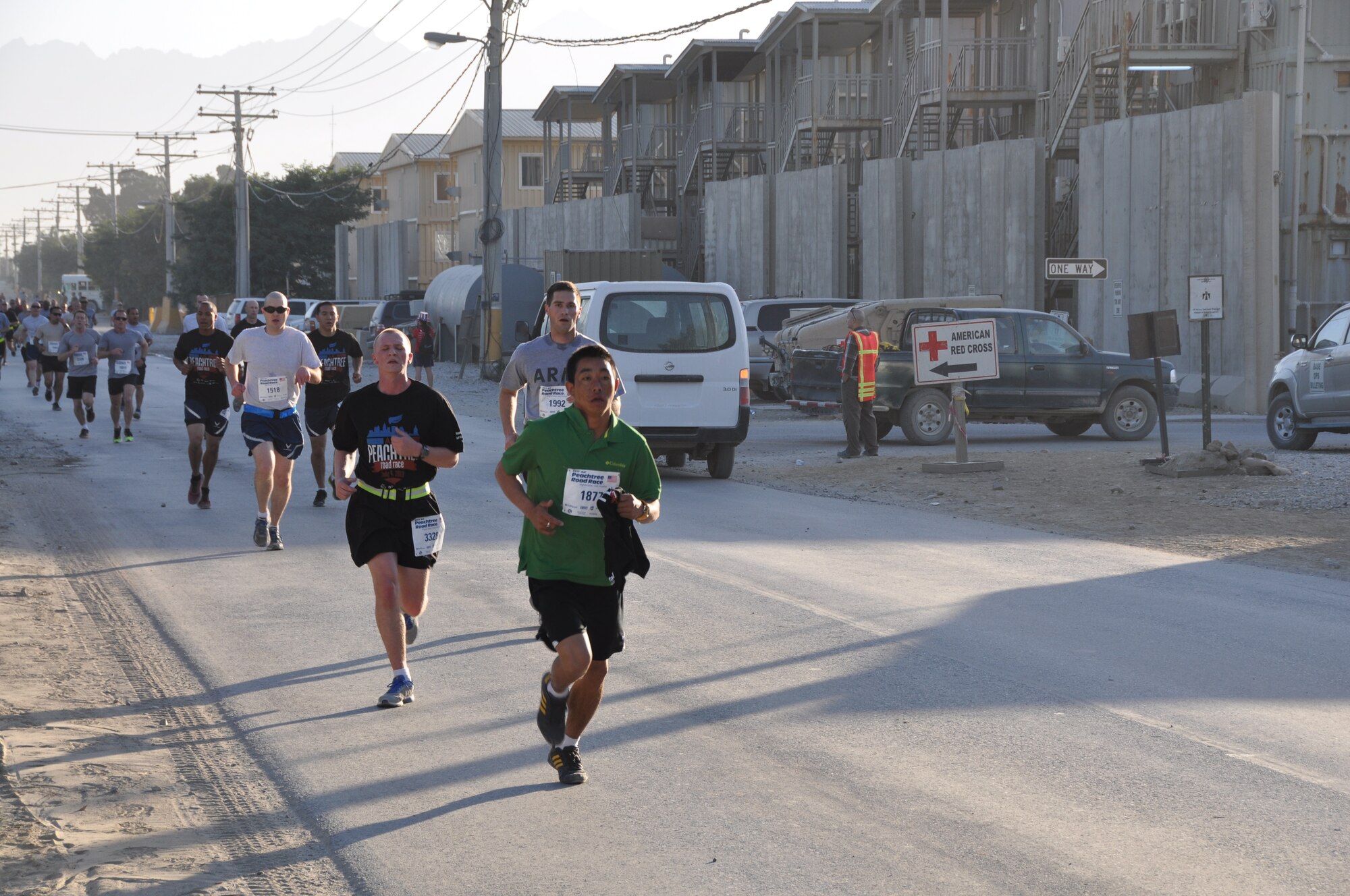 Several runners maintain a good pace during an overseas shadow for the Peachtree 10-kilometer run on Bagram Airfield, Afghanistan, July 4. The morale, welfare and recreation office coordinated with the Atlanta Track Club to hold the road race, which drew more than 600 runners. (U.S. Air Force photo/Tech. Sgt. Rob Hazelett)