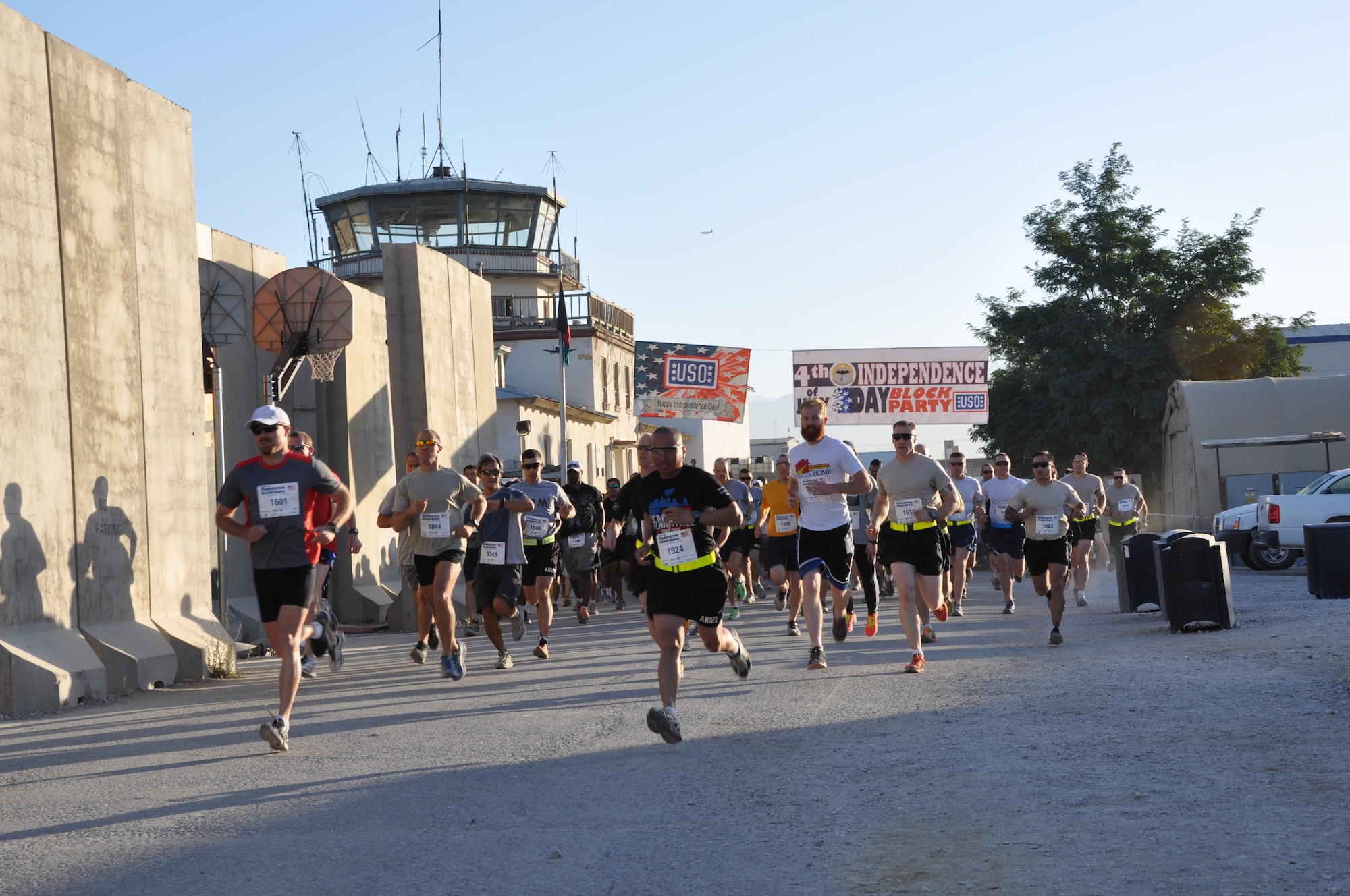 More than 600 runners start their run during an overseas shadow for the Peachtree 10-kilometer road race on Bagram Airfield, Afghanistan, July 4. The morale, welfare and recreation office coordinated with the Atlanta Track Club to hold the road race, which drew more than 600 runners. (U.S. Air Force photo/Tech. Sgt. Rob Hazelett)