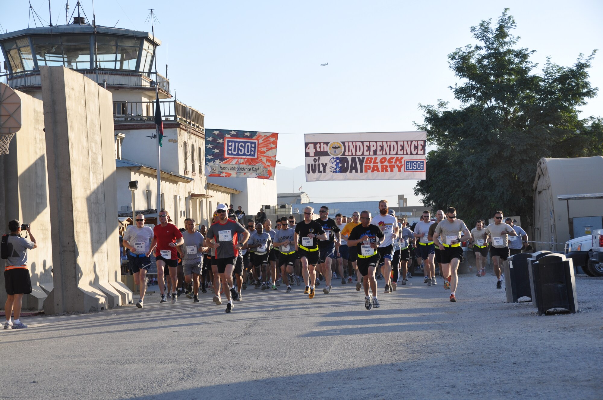 More than 600 runners start their run during an overseas shadow for the Peachtree 10-kilometer road race on Bagram Airfield, Afghanistan, July 4. The morale, welfare and recreation office coordinated with the Atlanta Track Club to hold the road race, which drew more than 600 runners. (U.S. Air Force photo/Tech. Sgt. Rob Hazelett)
