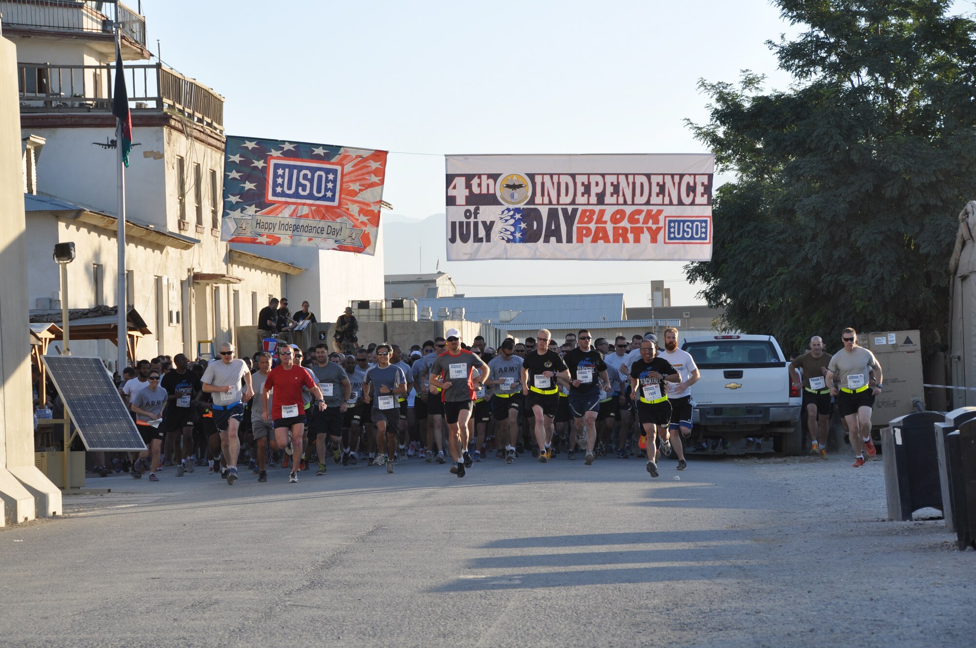 More than 600 runners start their run during an overseas shadow for the Peachtree 10-kilometer road race on Bagram Airfield, Afghanistan, July 4. The morale, welfare and recreation office coordinated with the Atlanta Track Club to hold the road race, which drew more than 600 runners. (U.S. Air Force photo/Tech. Sgt. Rob Hazelett)