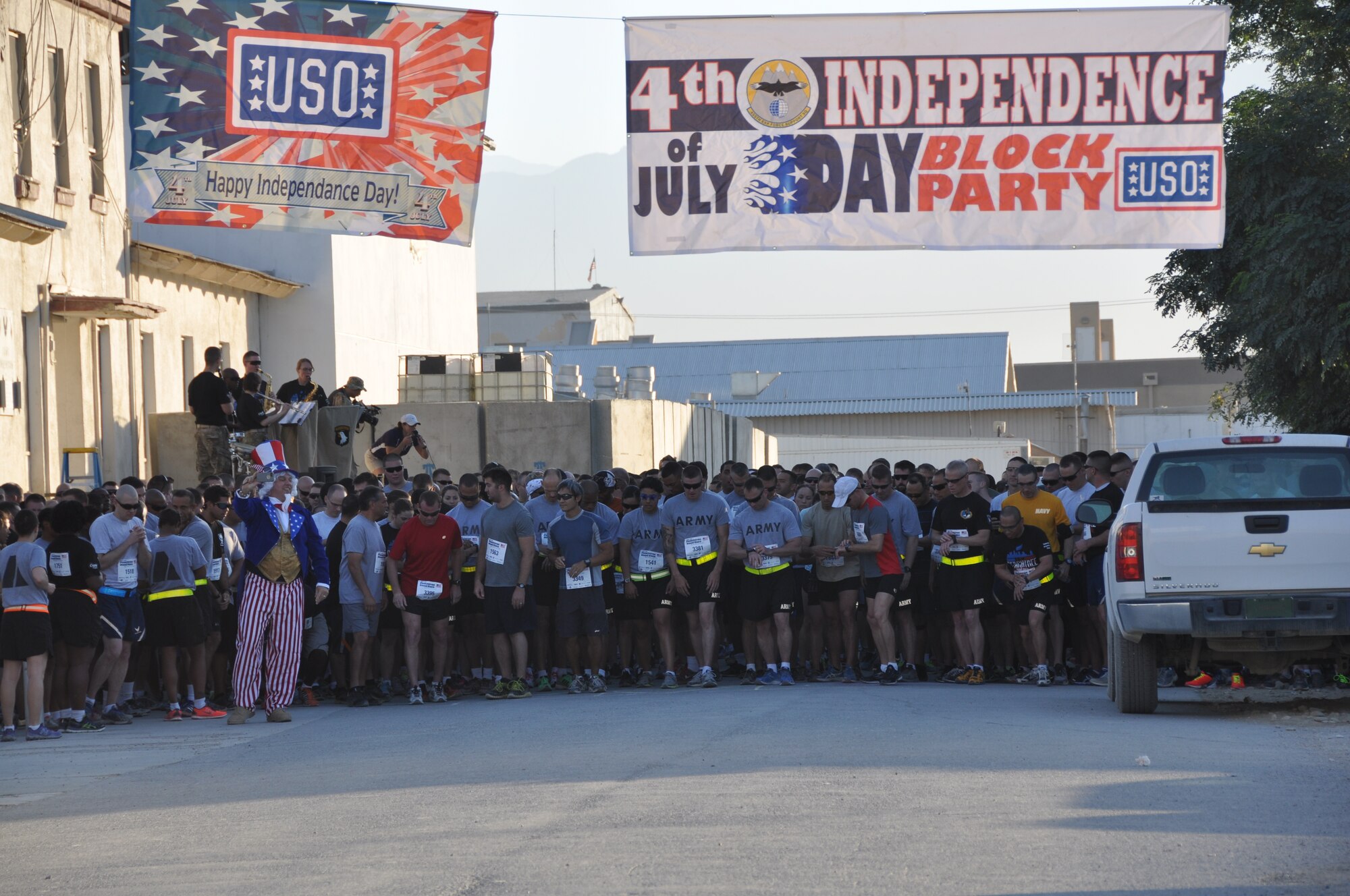 More than 600 runners take their places at the start line during an overseas shadow for the Peachtree 10-kilometer run on Bagram Airfield, Afghanistan, July 4. The morale, welfare and recreation office coordinated with the Atlanta Track Club to hold the road race, which drew more than 600 runners. (U.S. Air Force photo/Tech. Sgt. Rob Hazelett)
