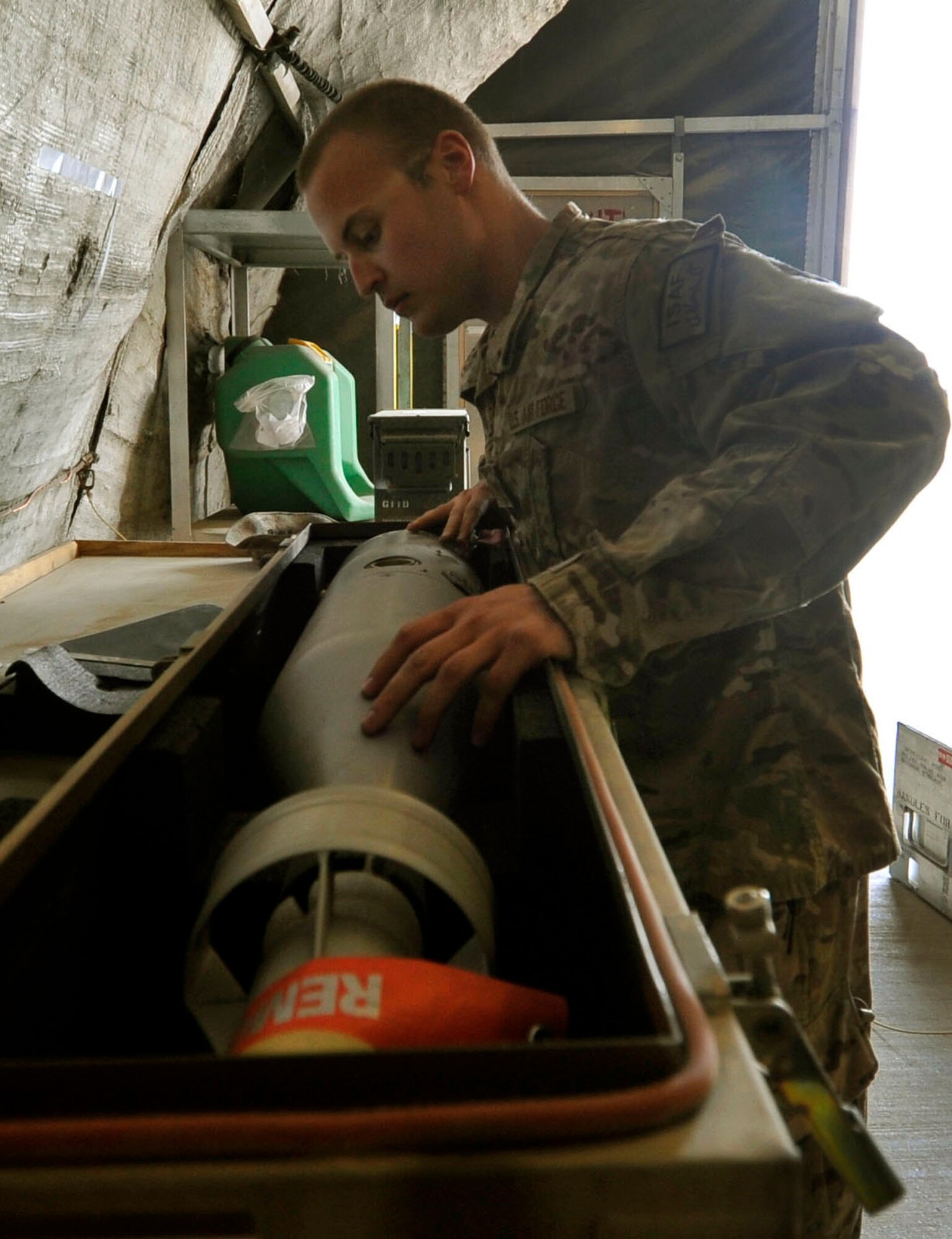 Staff Sgt. Joshua Snyder, 455th Expeditionary Munitions Flight munitions inspector, uses technical orders to complete a munitions inspection Bagram Airfield, Afghanistan, June 13, 2013. Before use or assembly all ammo’s assets must undergo a trip through an inspection. Depending on their condition the assets are classified in different serviceability codes.  Any malfunction, defect, or error in serviceability codes of these devices can prove deadly to both the ground crew and the pilot in the air. Snyder is deployed from Moody Air Force Base, Ga. and is a native of Howell, Mich. (U.S. Air Force photo/ Airman 1st Class Lance Caro)