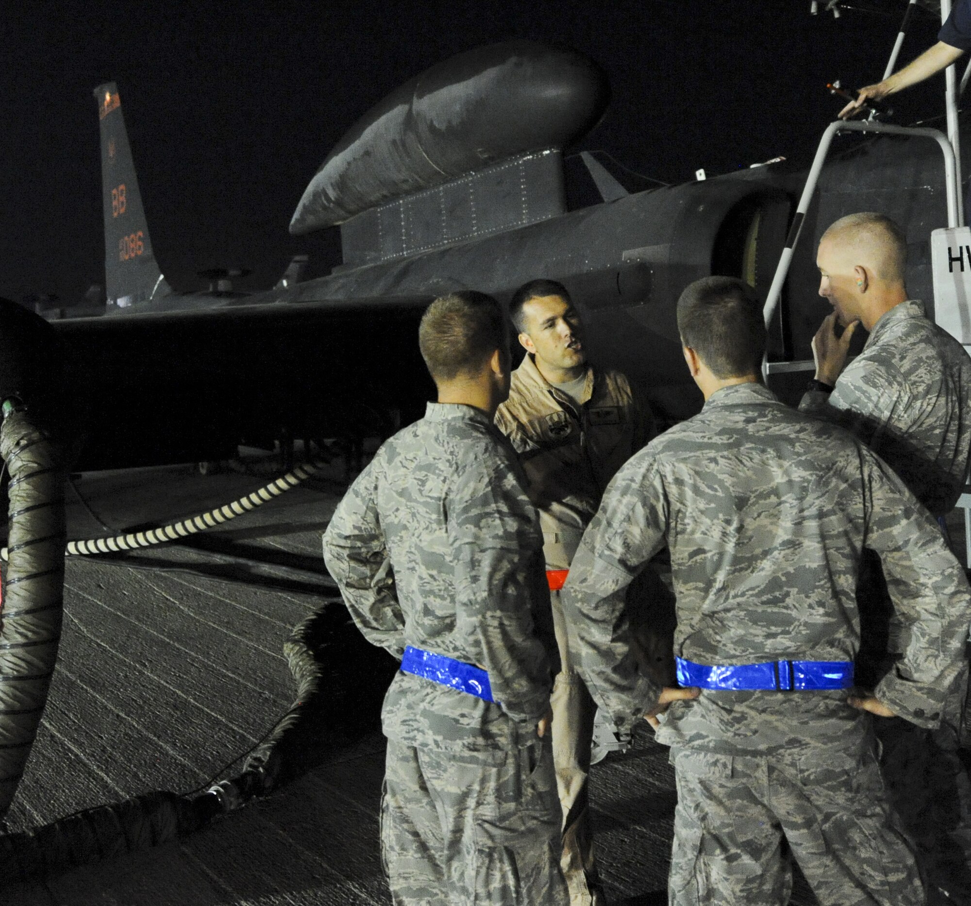 Capt. Steven Chapman, middle, 99th ERS U-2 Dragon Lady pilot, explains different systems on the U-2 to a group of cadets at an undisclosed location in Southwest Asia June 27, 2013. The cadets were visiting 380th Air Expeditionary Wing as part of the Air Force Academy’s Deployed Operations program. (U.S. Air Force photo by Senior Airman Jacob Morgan)