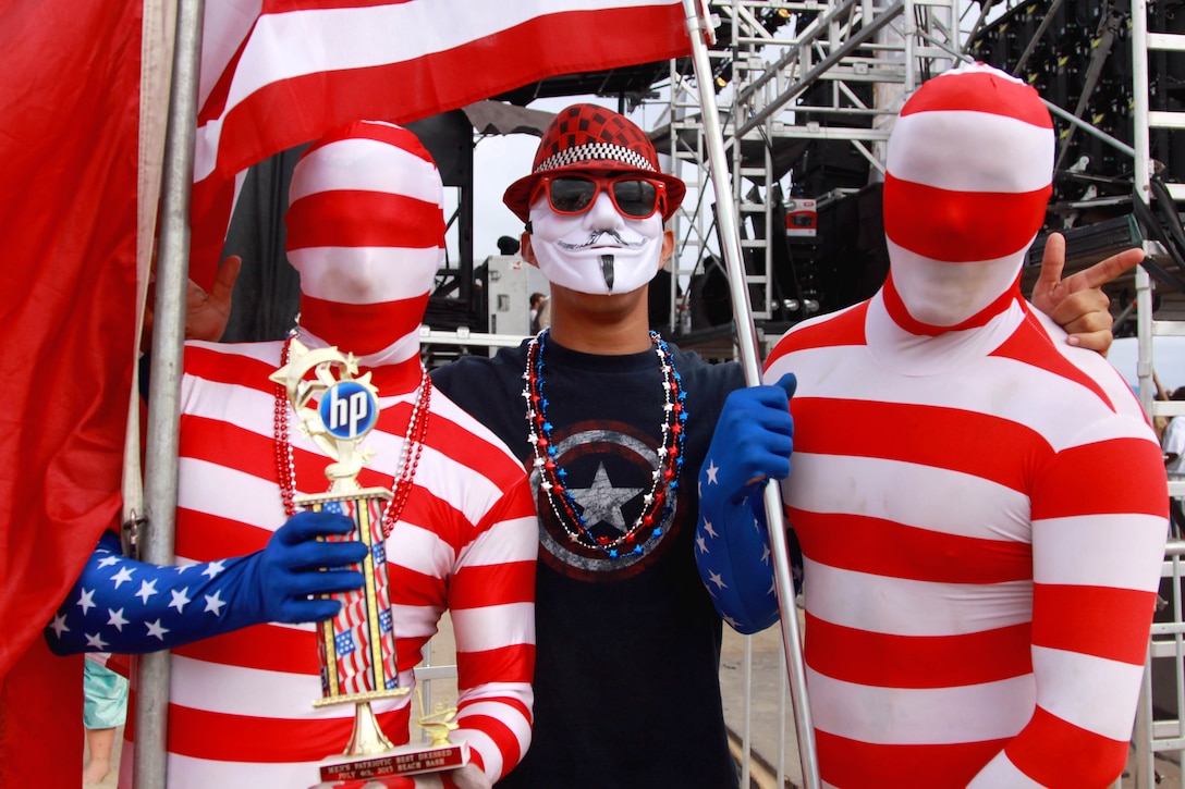 Lance Cpl. Matthew Cessna, left, and Cpl. Cody George, right, won first place for the sponsor HP’s Men’s Patriotic Best Dressed competition at Del Mar Beach here during the Fourth of July Beach Bash. The daylong event featured live entertainment, free give-aways, a military tribute video and concluded with fireworks. Cessna is a parachute rigger with Combat Logistics Group-17, 1st Marine Logistics Group here. George is an embarkation noncommissioned officer with 3rd Assault Amphibian Battalion, 1st Marine Division here.


