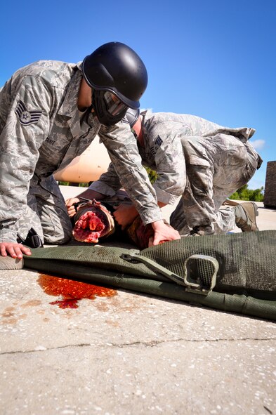 MACDILL AIR FORCE BASE, Fla. – Staff Sgt. Mark Butanis , 6th Aeromedical Medical Squadron independent duty medical technician, works to stabilize a dummy patient during the three-day Tactical Combat Casualty Care Course here. The course taught Airmen from active duty, reserve and Air National Guard elements the basics of emergency medical care in a tactical situation. (U.S. Air Force photo by Tech. Sgt. Shawn Rhodes)