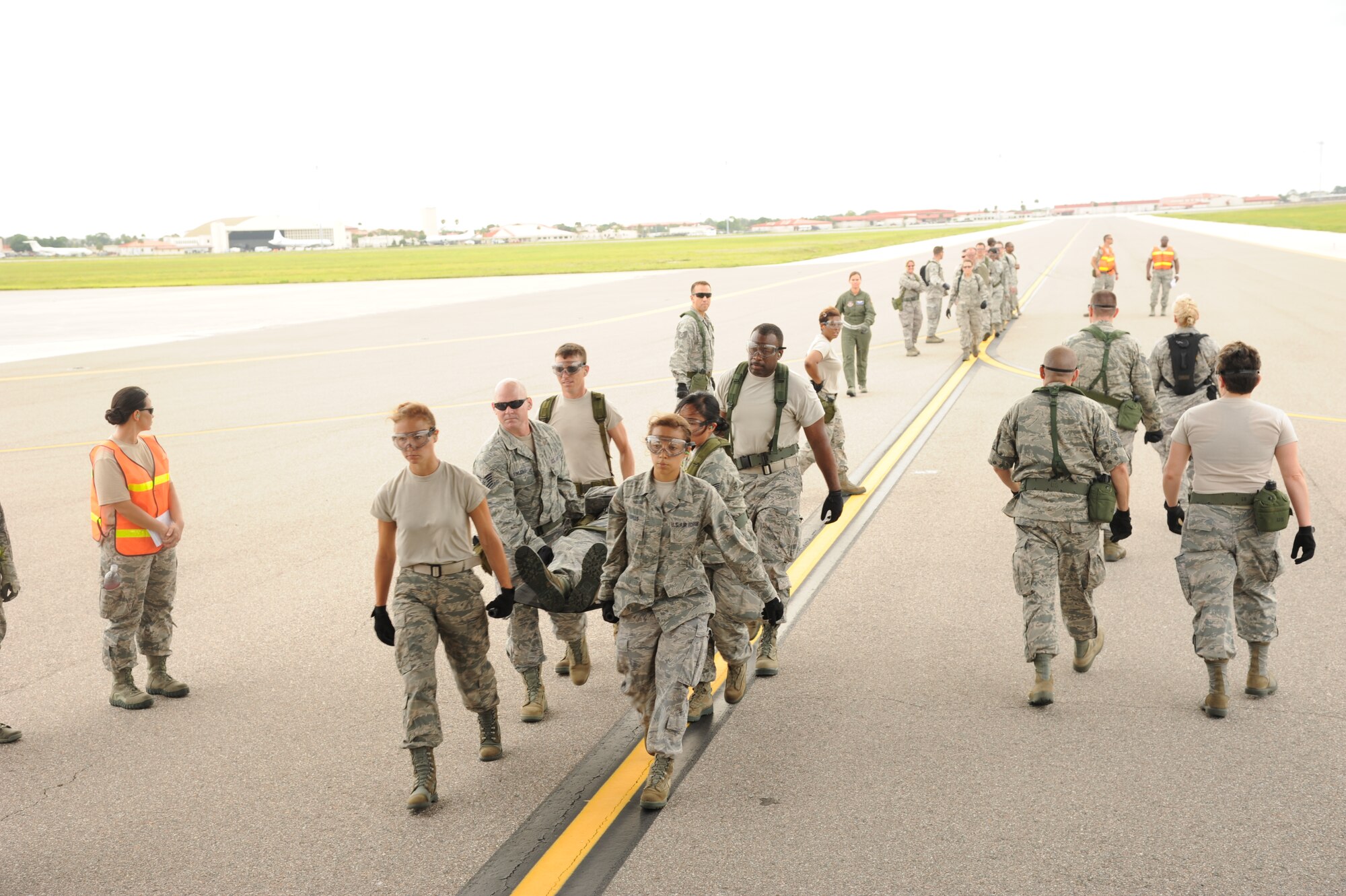 MACDILL AIR FORCE BASE, Fla. -- Reservists from the 927th Aeromedical Staging Squadron carry a litter with an "injured Airman" to the ramp of a waiting C-17 Globemaster during a medical exercise June 3, 2013 at MacDill Air Force Base, Fla. The 927th ASTS participated in a training exercise that prepares its members for the quick and efficient transfer of patients from their in-flight caretakers to a ground medical crew. (Official U.S. Air Force photo by Staff Sgt. Jennie Chamberlin)  