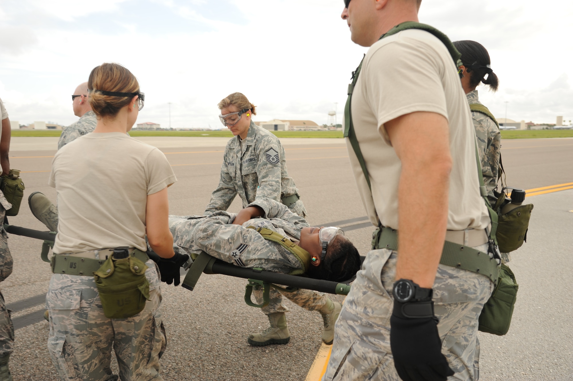 MACDILL AIR FORCE BASE, Fla. -- Reservists from the 927th Aeromedical Staging Squadron carry a litter with an "injured Airman" to the ramp of a waiting C-17 Globemaster during a medical exercise June 3, 2013 at MacDill Air Force Base, Fla. The 927th ASTS participated in a training exercise that prepares its members for the quick and efficient transfer of patients from their in-flight caretakers to a ground medical crew. (Official U.S. Air Force photo by Staff Sgt. Jennie Chamberlin)  