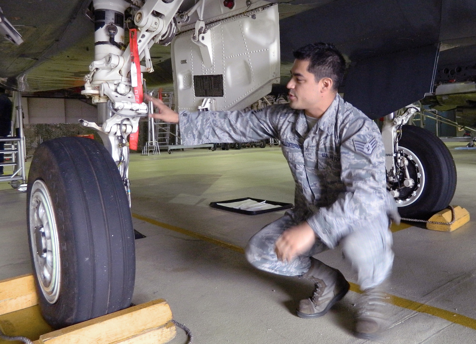 ROYAL AIR FORCE LAKENHEATH, England -- Staff Sgt. Erick Ballesteros, 48th Equipment Maintenance Squadron Repair and Reclamation craftsman, inspects landing gear doors July 2, 2013. One of the responsibilities of the Repair and Reclamation section is to rig and inspect the landing gear to make sure it is operational. (U.S. Air Force photo by Elizabeth Ritsema)