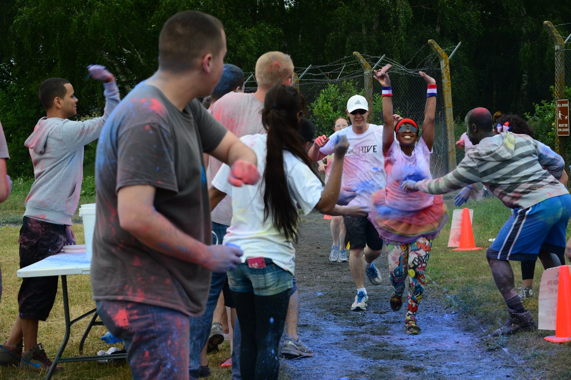 ROYAL AIR FORCE LAKENHEATH, England – Liberty Airmen and their families are splashed with powder paint during the RAF Lakenheath color run July 4, 2013. More than 400 runners participated in the color run; the money raised went towards the upcoming Air Force Ball. (U.S. Air Force photo by Airman 1st Class Dana Butler)
