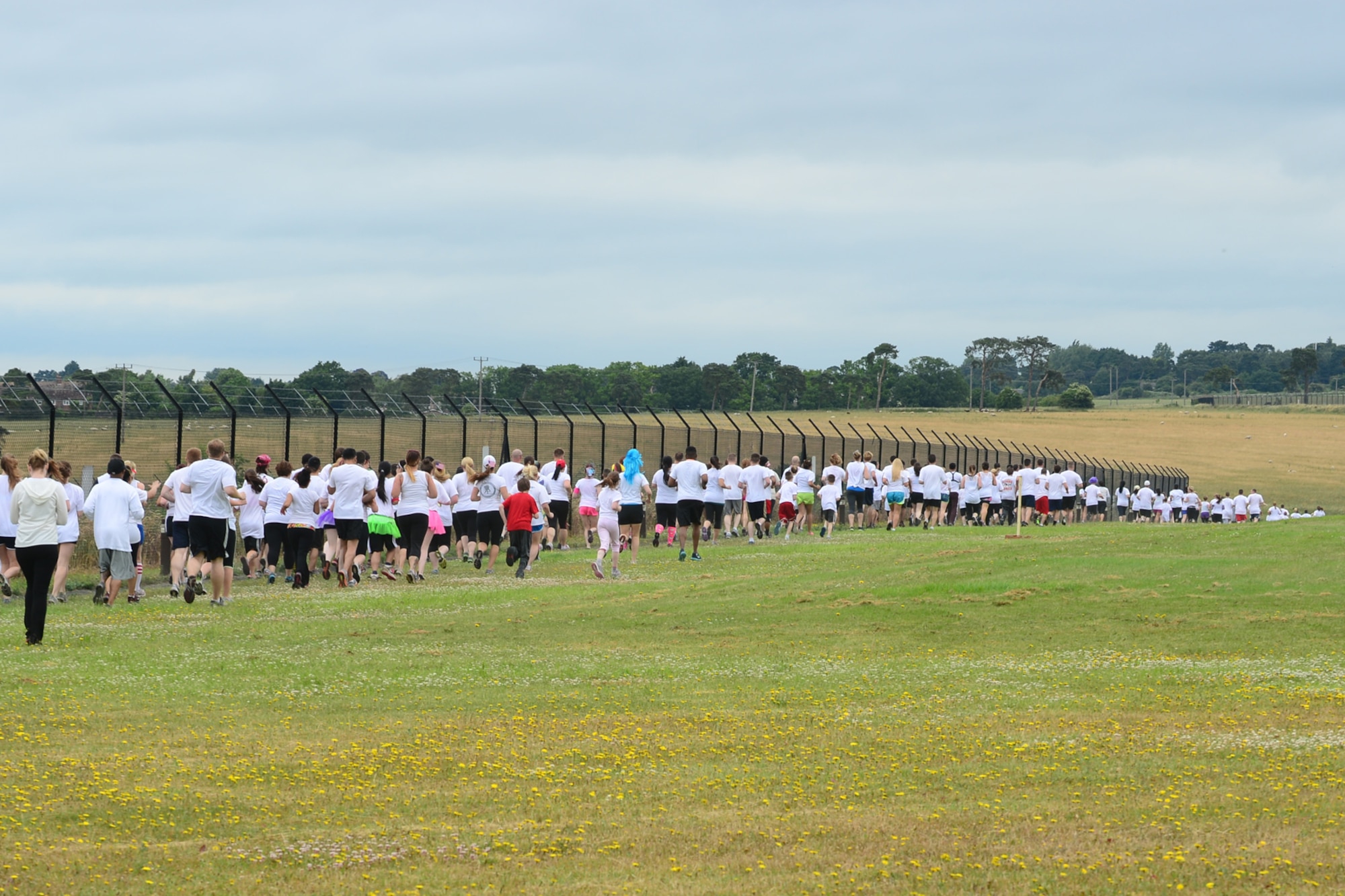 ROYAL AIR FORCE LAKENHEATH, England – More than 400 Airmen and family members participated in the RAF Lakenheath color run July 4, 2013. Organizers held the event to benefit the upcoming Air Force Ball in September. (U.S. Air Force photo by Airman 1st Class Dana Butler)