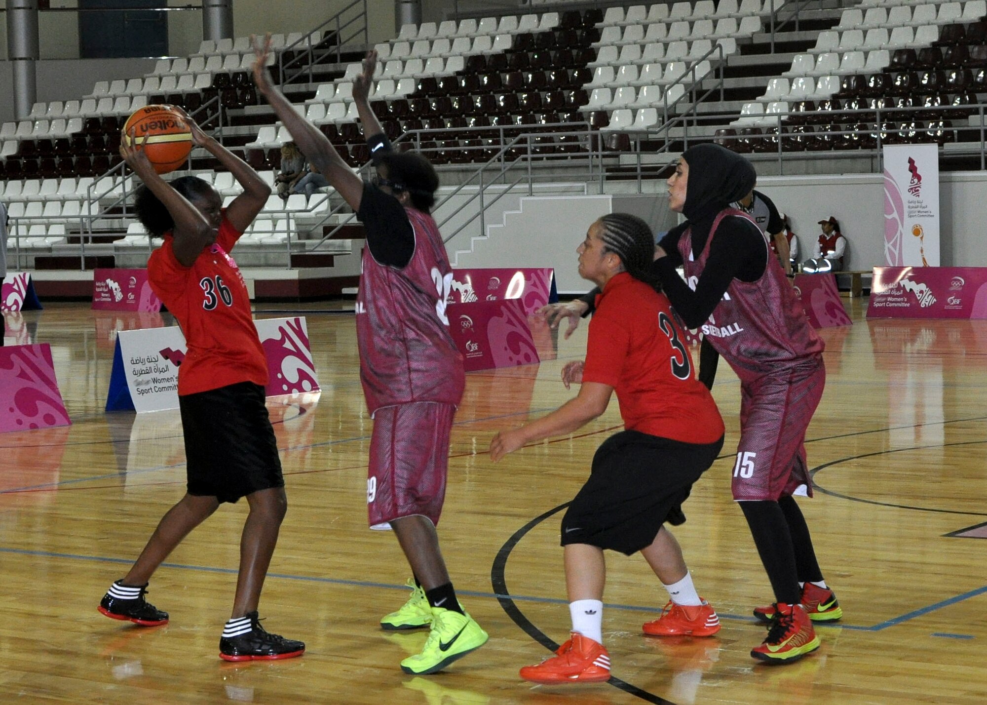 Staff Sgt. Imelda Udombang looks for a pass during a local women’s basketball tournament in Southwest Asia, June 28, 2013. Eight service members from the Army camp and air base participated in the tournament, interacting with the local public and strengthening the base’s partnership with the surrounding community.  Udombang is an 8th Expeditionary Air Mobility Squadron air transportation journeyman deployed from Spangdahlem Air Base, Germany. (U.S. Air Force photo/1st Lt. Susan Harrington)