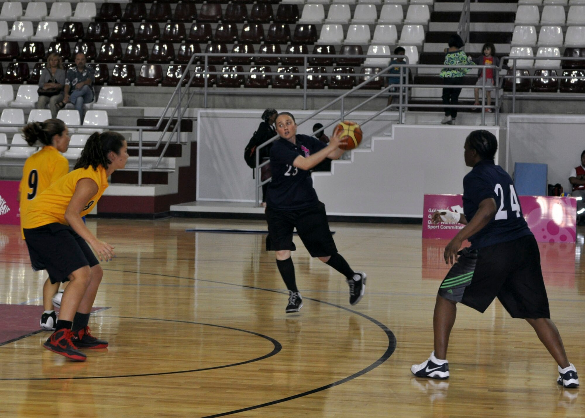 Army Staff Sgt. Christine Hohl receives a pass during a local women’s basketball tournament in Southwest Asia, June 28, 2013.  The tournament was hosted by the local Women’s Sports Committee, and they invited service members from the Army camp and air base to participate. Hohl is the 69th Air Defense Artillery Brigade NCO in charge deployed from Fort Hood, Texas. (U.S. Air Force photo/1st Lt. Susan Harrington)
