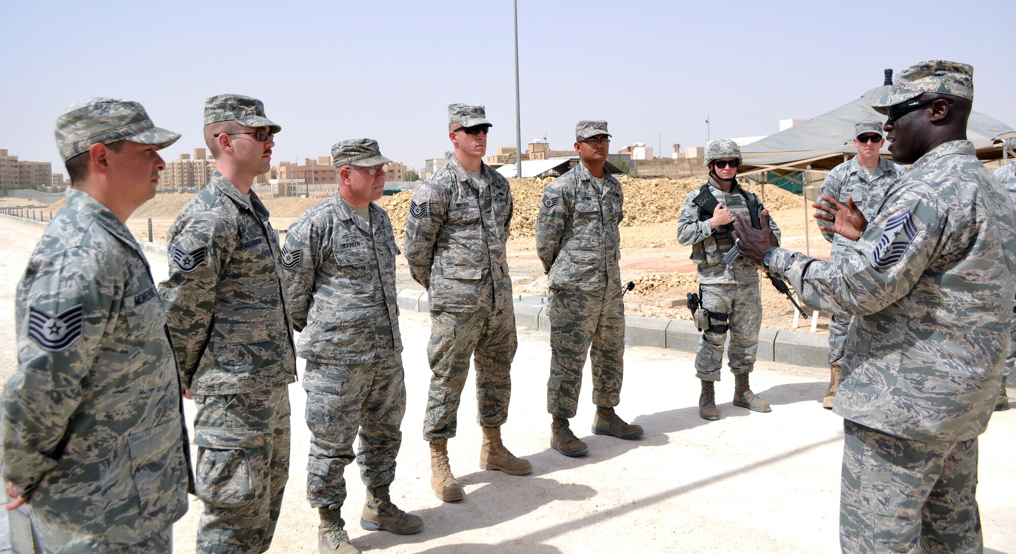 The 379th Air Expeditionary Wing top officer and enlisted leaders visited the 64th Air Expeditionary Group in Southwest Asia, June 18 and 19, 2013, to meet with Airmen from across the group and see first-hand how their missions uniquely contribute to continuing operations in the U.S. Central Command’s area of operations. (Courtesy photo)