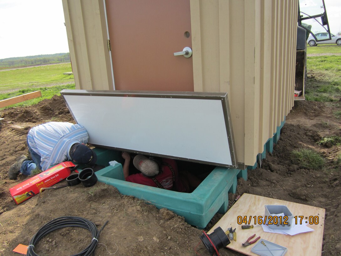 A composting toilet is installed at Camp Atterbury, Ind. between training ranges 18 and 19.
