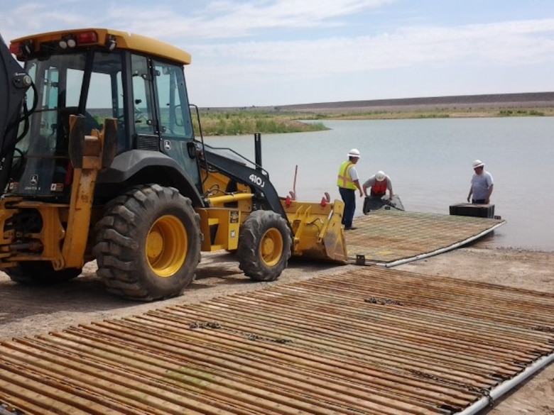 CONCHAS LAKE, N.M., -- Workers install the temporary boat ramp at the Corps' South Boat Ramp July 3, 2013.  The ramp had been closed for more than a year due to low lake levels, but is now open for boats.