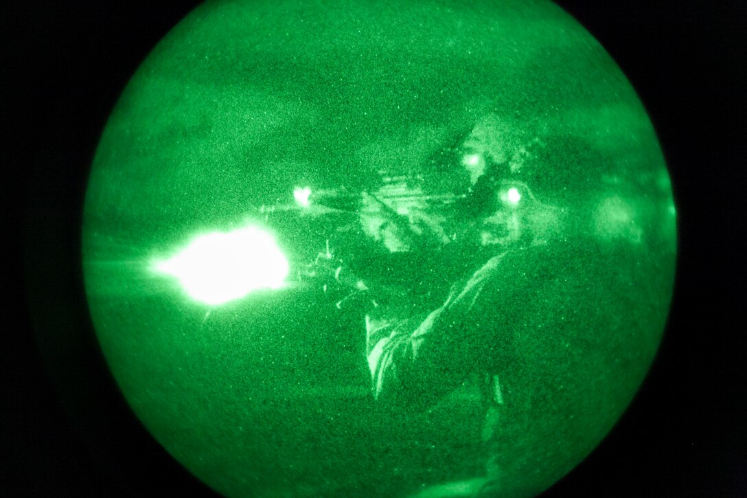 Marines with Company E., Battalion Landing Team 2nd Battalion, 4th Marines, 31st Marine Expeditionary Unit, use night vision goggles to fire on silhouette targets during close quarters, low-light combat marksmanship training from the flight deck here, July 5. More than 100 Marines of the company were able to test their night-time marksmanship on the flight deck, expending thousands of rounds of ammunition over a period of three hours. The 31st MEU is the Marine Corps’ force in readiness for the Asia Pacific region and the only continuously forward-deployed MEU. 