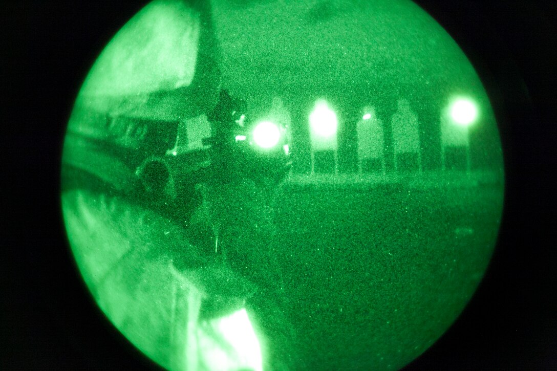A Marine with Company E., Battalion Landing Team 2nd Battalion, 4th Marines, 31st Marine Expeditionary Unit, sights in on silhouette targets during close quarters, low-light combat marksmanship training from the flight deck here, July 5. More than 100 Marines of the company were able to test their night-time marksmanship on the flight deck, expending thousands of rounds of ammunition over a period of three hours. The 31st MEU is the Marine Corps’ force in readiness for the Asia Pacific region and the only continuously forward-deployed MEU. 