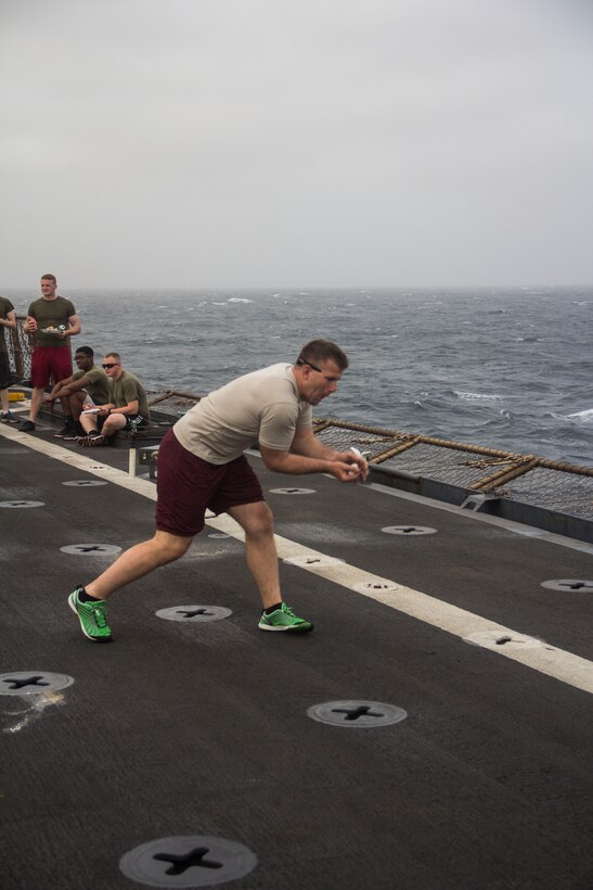 U.S. Marine Corps Capt. Jonathan Riebe, Amphibious Assault Vehicle Platoon commander from Colorado Springs, Co., assigned to Battalion Landing Team 3/2, 26th Marine Expeditionary Unit (MEU), catches an egg during the Independence Day celebration aboard the USS Carter Hall (LSD 50) while at sea July 4, 2013. The 26th MEU is a Marine Air-Ground Task Force forward-deployed to the U.S. 5th Fleet area of responsibility aboard the Kearsarge Amphibious Ready Group serving as a sea-based, expeditionary crisis response force capable of conducting amphibious operations across the full range of military operations. (U.S. Marine Corps photo by Cpl. Michael S. Lockett/Released)