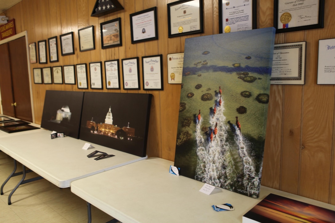 Photos created by members of Camp Lejeune Photographers, a casual Facebook group not associated with the base, were showcased during an exhibit, in Swansboro, N.C., June 22. Sales of the photos support the Swansboro chapter of Veterans of Foreign Wars.