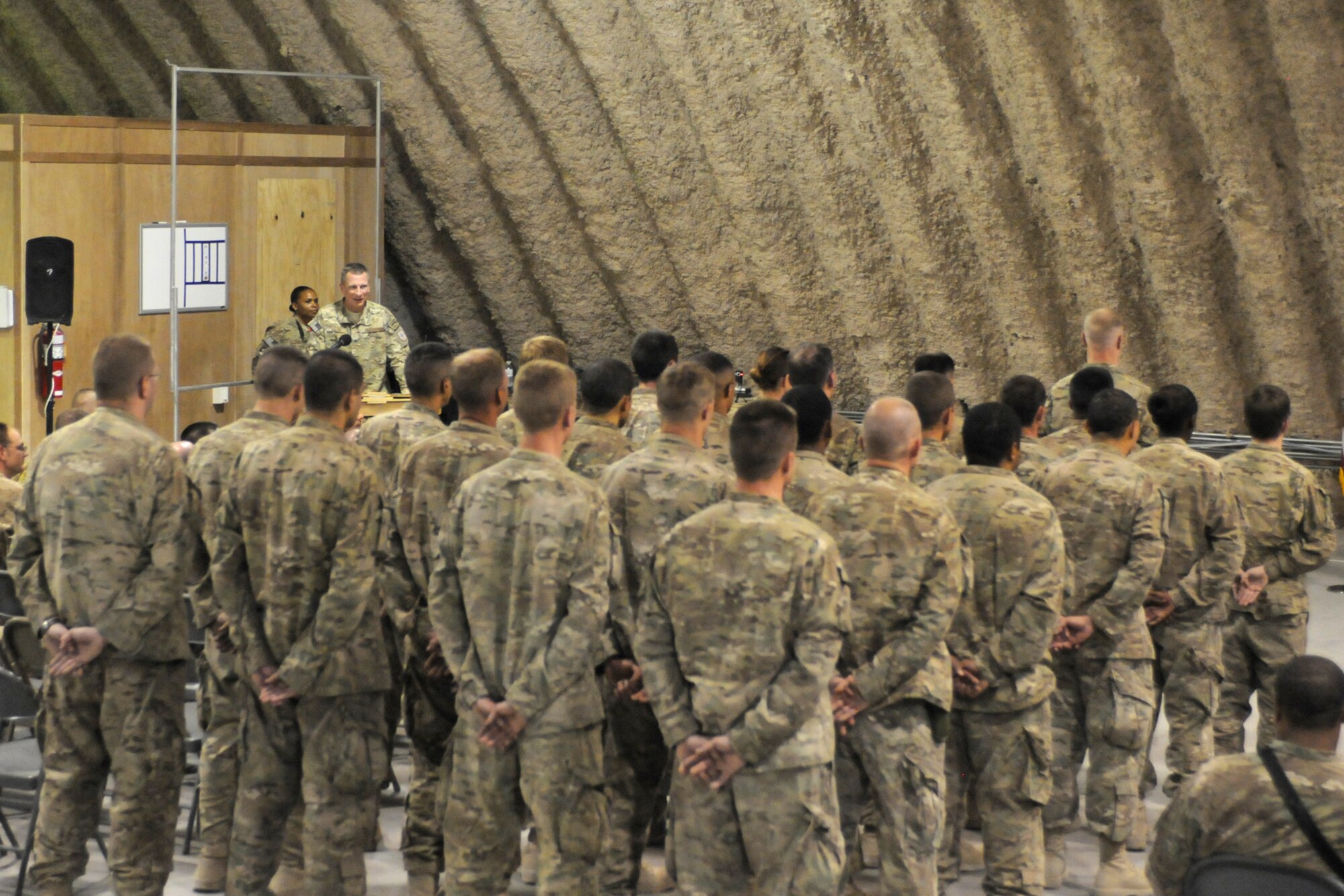 U.S. Air Force Brig. Gen. John Dolan, 451st Air Expeditionary Wing commander, addresses members of the 451st Expeditionary Maintenance Group during an assumption of command ceremony at Kandahar Airfield, Afghanistan, July 5, 2013. Dolan presented U.S. Air Force Col. Matthew Powell, an Arlington, Mass., native, with command of the 451st EMXG during the ceremony. (U.S. Air Force photo/Capt. Brian Maguire)