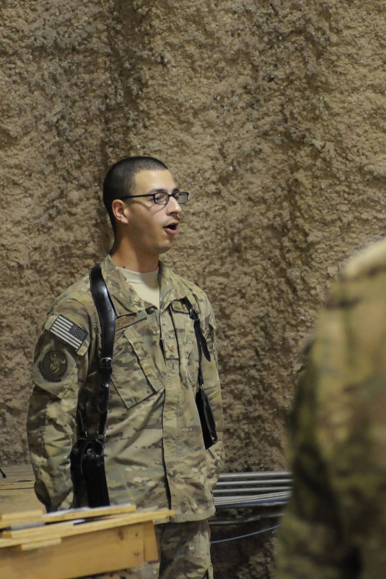 Staff Sgt. Patrick Castro, 577th Expeditionary Prime Base Engineer Emergency Force Squadron and is deployed from Keesler Air Force Base, Miss., sings the national anthem during the 451st Expeditionary Maintenance Group Assumption of Command ceremony at Kandahar Airfield, Afghanistan, July 5, 2013. U.S. Air Force Col. Matthew Powell, an Arlington, Mass., native, assumed command of the 451st EMXG during the ceremony. (U.S. Air Force photo/Capt. Brian Maguire)