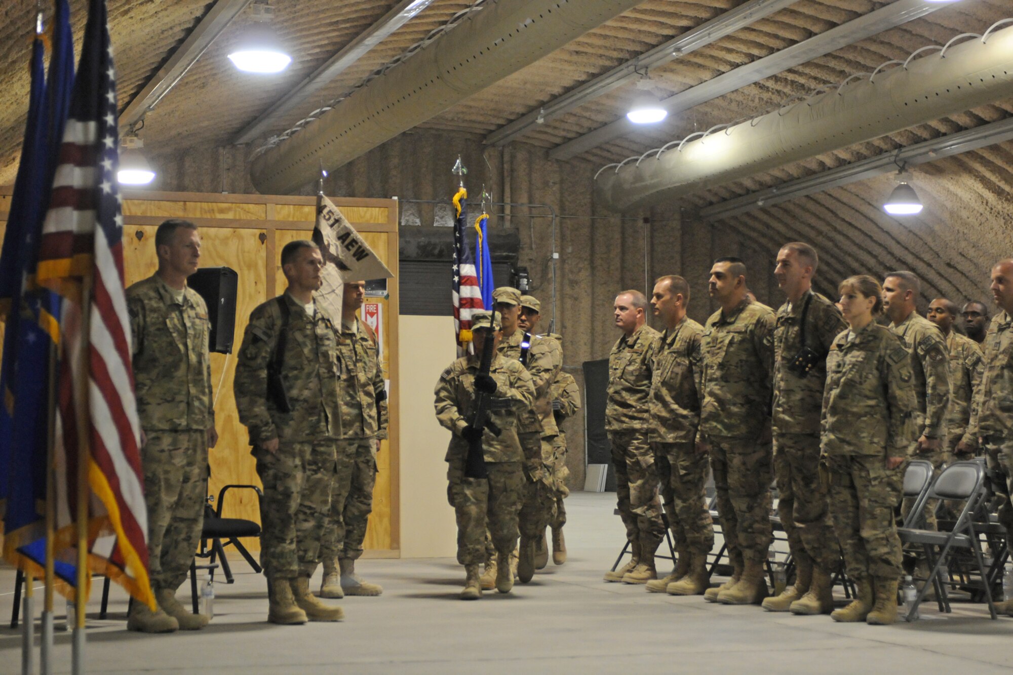 The 451st Air Expeditionary Wing Honor Guard presents the colors at the start of the 451st Expeditionary Maintenance Group Assumption of Command ceremony at Kandahar Airfield, Afghanistan, July 5, 2013. U.S. Air Force Col. Matthew Powell assumed command of the 451st EMXG, which enables a persistent, powerful airpower presence throughout the Afghanistan area of operations through world-class flightline, backshop and munitions support. (U.S. Air Force photo/Capt. Brian Maguire) 