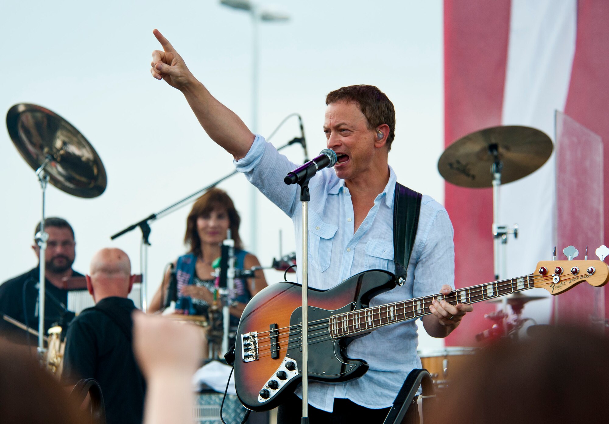 YOKOTA AIR BASE, Japan – Actor Gary Sinise greets the crowd at Yokota Air Base, Japan, July 4, 2013.  Sinise and his Lt. Dan Band held a show for the armed service members and their family at Yokota.  (U.S. Air Force photo by Airman 1st Class Soo C. Kim)