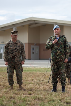 Bulgarian Army Colonel Iavor Mateev, right, officer-in-charge of Bulgarian forces participating in Black Sea Rotational Force 13, addresses Bulgarian, Serbian, Romanian and American forces at Novo Selo, Bulgaria, during an opening ceremony July, 1, 2013. The opening ceremony marked the beginning of Platinum Lion 13, BSRF-13’s five week exercise in Bulgaria. The exercise allows the U.S. and Balkan military forces to practice stability, counterinsurgency, and peacekeeping operations in order to build partner nation capacity, enhance interoperability between countries and increase the overall effectiveness of the participating partnered nations. (U.S. Marine Corps photo by 1st Lt. Hector Alejandro)