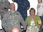 Maj. Mark Woodsmall and his new bride, Beth, greet their wedding guests for the first time as husband and wife. The couple was married early April in the chapel at Muscatatuck Urban Training Center in Butlerville, Ind. Woodsmall was attending weekend training with the 38th Infantry Division's Special Troops Battalion in preparation for deployment to Afghanistan.