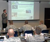 Bob Reininger, North American Aerospace Defense Command and U.S. Northern Command Interagency Coordination office, speaks to more than 50 National Guard officers during the Joint Task Force Commander Training Course June 14. the course is designed to prepare potential joint task force commanders to coordinate active-duty, National Guard and federal civilian agencies during a crisis. 

