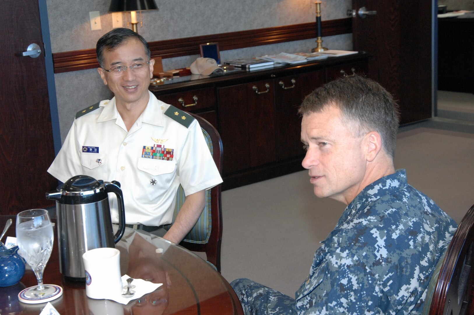 PETERSON AIR FORCE BASE, Colo. - Japanese Maj. Gen. Koichi Isobe, Japan Self Defense Force Joint Staff J5 Director, speaks with Navy Adm. James Winnefeld, North American Aerospace Defense Command and U.S. Northern Command commander, before the start of the Joint Staff Conference at NORAD and USNORTHCOM headquarters July 13. The Joint Staff Conference provides senior military leaders from both countries an opportunity to focus on the implications of possible future military scenarios and mutually educate both joint staffs in the areas of missile defense, cyberspace defense, space and joint air and sea battle. The conference ends Friday. (U.S. Air Force photo by Staff Sgt. Thomas J. Doscher)