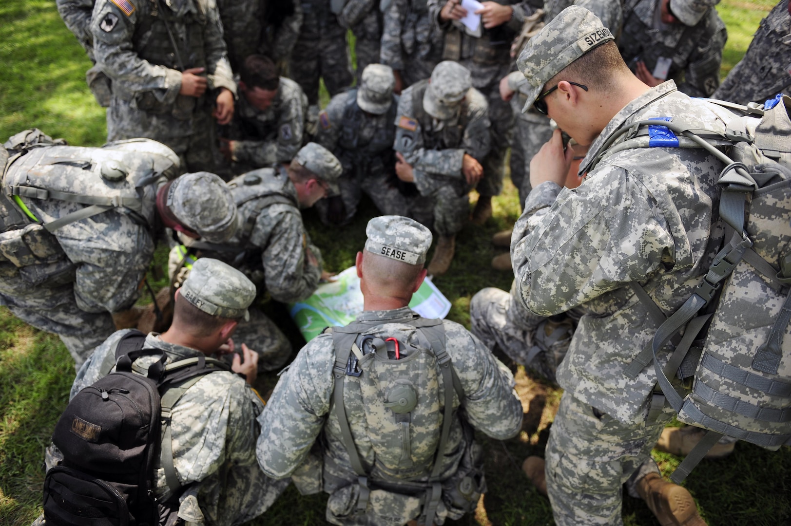 U.S. Soldiers with Alpha Company, 4th Battalion, 118th Infantry Regiment brief and plan an excavation mission for Vibrant Response 10.2 at Camp Atterbury, Ind., July 15, 2010. Vibrant Response, a U.S. Northern Command exercise for Chemical, Biological, Radiological, Nuclear and High-Yield Explosive Consequence Management Response Force 10.2, focuses on Department of Defense support of civil authorities in a consequence management role. (U.S. Air Force photo by Airman 1st Class Samuel W. Goodman/Released)  
