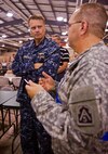 Adm. James Winnefeld Jr., commander of North American Aerospace Defense Command and U.S. Northern Command, speaks with Maj. Gen. John Basilica Jr., commander of U.S. Army North’s Joint Task Force – 51, at the Camp Atterbury Joint Maneuver Training Center, Ind., July 16, about the Vibrant Response 10.2 field training exercise, a national emergency response exercise aimed at preparing our first responders for the unthinkable, a nuclear blast in a major U.S. city. The exercise is facilitated by U.S. Army North's Joint Task Force – 51, headquartered in San Antonio. 

