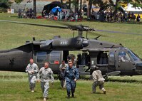 Adm. James Winnefeld Jr., commander of North American Aerospace Defense Command and U.S. Northern Command, exits a UH-60 Blackhawk helicopter with other key leaders July 16 to visit the Muscatatuck Urban Training Center in Butlerville, Ind. The leaders observed the training underway during the Vibrant Response 10.2 field training exercise, a national emergency response scenario aimed at preparing our first responders for the unthinkable – a nuclear blast in a major U.S. city. The exercise is facilitated by U.S. Army North's Joint Task Force – 51, headquartered in San Antonio. 

