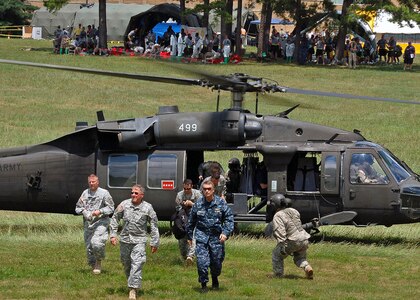 Adm. James Winnefeld Jr., commander of North American Aerospace Defense Command and U.S. Northern Command, exits a UH-60 Blackhawk helicopter with other key leaders July 16 to visit the Muscatatuck Urban Training Center in Butlerville, Ind. The leaders observed the training underway during the Vibrant Response 10.2 field training exercise, a national emergency response scenario aimed at preparing our first responders for the unthinkable – a nuclear blast in a major U.S. city. The exercise is facilitated by U.S. Army North's Joint Task Force – 51, headquartered in San Antonio. 

