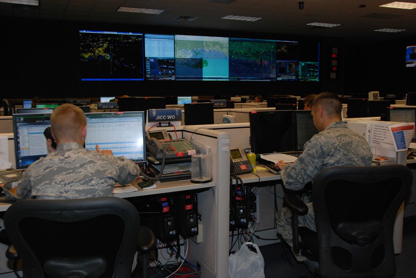 Aviation Coordination Command airspace managers deconflicting airspace issues on the ACC Operations floor. The Aviation Coordination Command was created to provide support to the U.S. Coast Guard for Deepwater Horizon Response air operations.