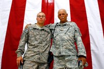 A 59-year-old Florida National Guard Soldier serving in Iraq got an early Father's Day present recently as he met up with his 21-year-old grandson, who is also deployed to the combat zone. Staff Sgt. Paul Weekley, a member of B Company, 146th Signal Battalion, reunited with his grandson Spc. Cory Lincourt briefly at Victory Base Complex shortly before Father's Day. Lincourt is an Air and Missile Defense crewmember attached to the 108th Airborne Brigade. Prior to deploying to Iraq last Fall, Weekley said he hoped to cross paths with grandson while in Southwest Asia. "If I can get over there and get with him, I'm gonna try," Weekley said before his unit left Florida. "It isn't every day you get a grandfather and grandson serving together over there." Weekley is also a Vietnam veteran, and joined the Florida National Guard in 1973. His unit is based in Pensacola, Fla., and is scheduled to return later this year.