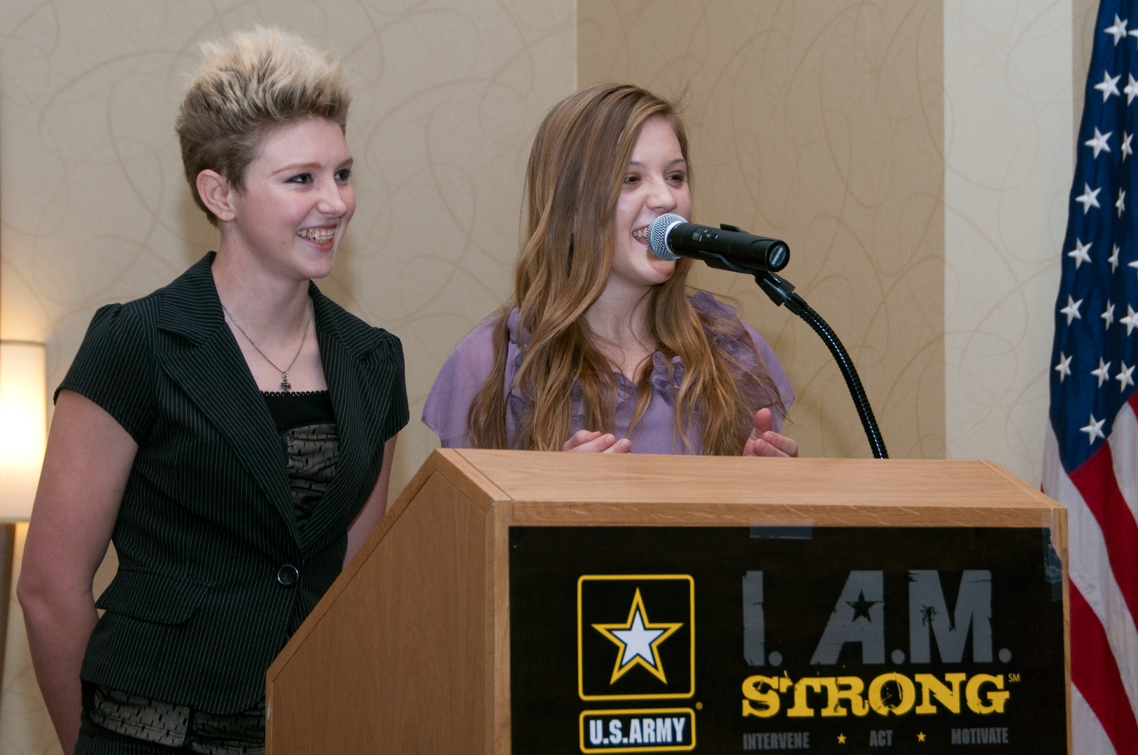 Moranda Hern, 17, and Kaylei Deakin, 16, discuss their experiences as daughters of California National Guardsmen during the Adjutant General's Symposium on Family Readiness in Burlingame, Calif., earlier this year. The two girls plan to hold a conference for the daughters of California Guardsmen next year.