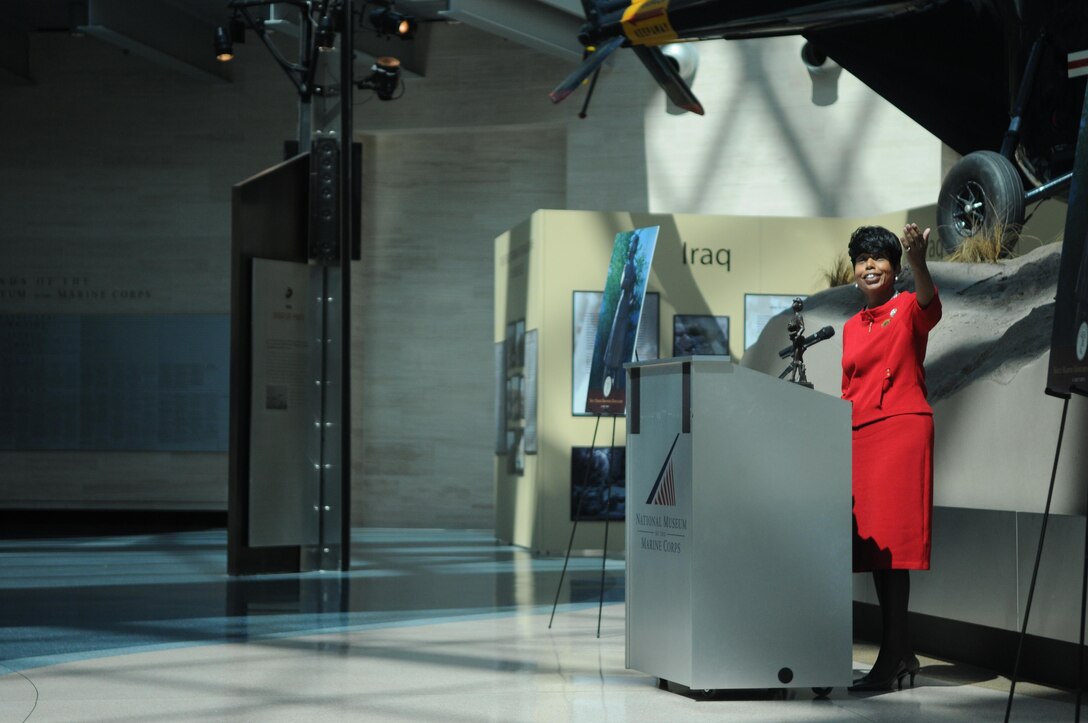 Betty Moseley-Brown, president of the Women Marines Association, addresses the crowd gathered in the atrium of the National Museum of the Marine Corps to celebrate the dedication of the museum’s new Molly Marine statue July 5, 2013. 