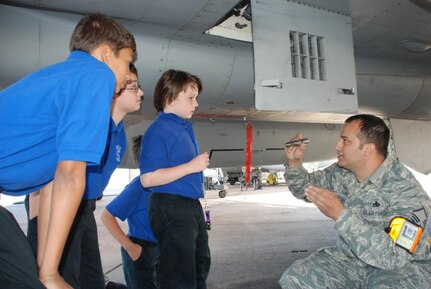 Louisiana Air National Guard Master Sgt. David A. Quintero of Destrehan, La., 159th Fighter Squadron weapons specialist, talks with students from Patrick F. Taylor Science and Technology Academy in Jefferson, La., during a tour of the Louisiana National Guard’s New Orleans Naval Air Station, Joint Reserve Base in Belle Chasse, La., April 23, 2009. The students were invited to visit the facility for their hard work and involvement in the Stay on Track program, which is sponsored by the LANG’s Counterdrug Program.