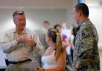 John Arnold, Military Family Life Consultant for the Florida National Guard (left) talks to a Soldier and his spouse during a Yellow Ribbon Program event for the 2nd Battalion, 124th Infantry Regiment, in Orlando, Fla., Sept. 12, 2009.