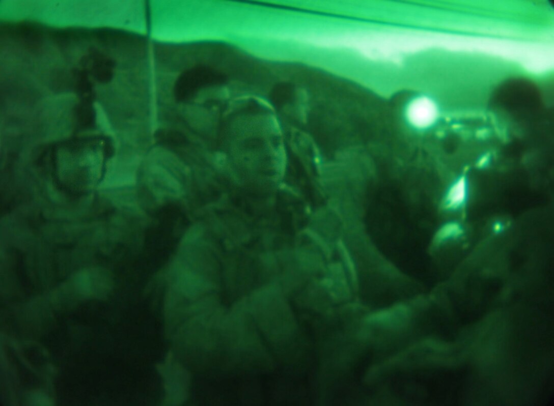 Marines with Light Armored Reconnaissance Company, Battalion Landing Team 1/4, 13th Marine Expeditionary Unit, review the scheme of maneuver for a training assault on a mock enemy camp as part of PHIBRON-MEU Integration aboard Marine Corps Base Camp Pendleton, Calif.,  June 25, 2013. PMINT is a three week long pre-deployment training event focusing on the combined Marine Expeditionary Unit and Amphibious Ready Group capabilities and the strengthening of the Navy and Marine Corps team. (Official U.S. Marine Corps photo illustration by Sgt. Christopher O’Quin/Released)