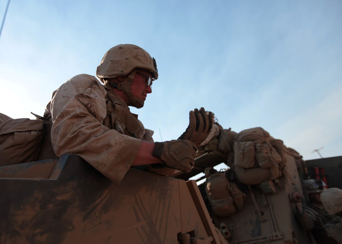 Lance Cpl. Bryan N. Ray, a scout with Blue Platoon, Light Armored Reconnaissance Company, Battalion Landing Team 1/4, 13th Marine Expeditionary Unit and Champaign, Ill. native, takes a moment to relax at an assembly area after a training raid during PHIBRON-MEU Integration aboard Marine Corps Base Camp Pendleton, Calif., June 26, 2013. PMINT is a three week long pre-deployment training event focusing on the combined Marine Expeditionary Unit and Amphibious Ready Group capabilities and the strengthening of the Navy and Marine Corps team. (Official U.S. Marine Corps photo by Sgt. Christopher O’Quin/Released)