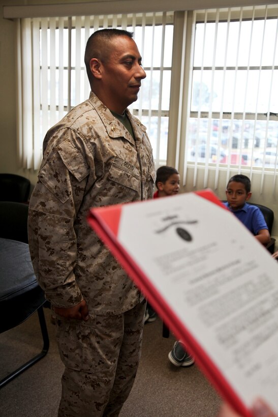 130701-M-YG378-005 MARINE CORPS BASE CAMP PENDLETON, Calif. (July 1, 2013) Major Raul Rizzo, senior intelligence officer, 15th Marine Expeditionary Unit, stands at the position of attention during his promotion ceremony held in the unit’s conference room on Marine Corps Base Camp Pendleton, Calif., July 1. The 15th MEU recently returned from an eight-month deployment to the Western Pacific. Rizzo, 41, is from Myrtle Beach, S.C. (U.S. Marine Corps photo by Sgt. John Robbart III/Released)