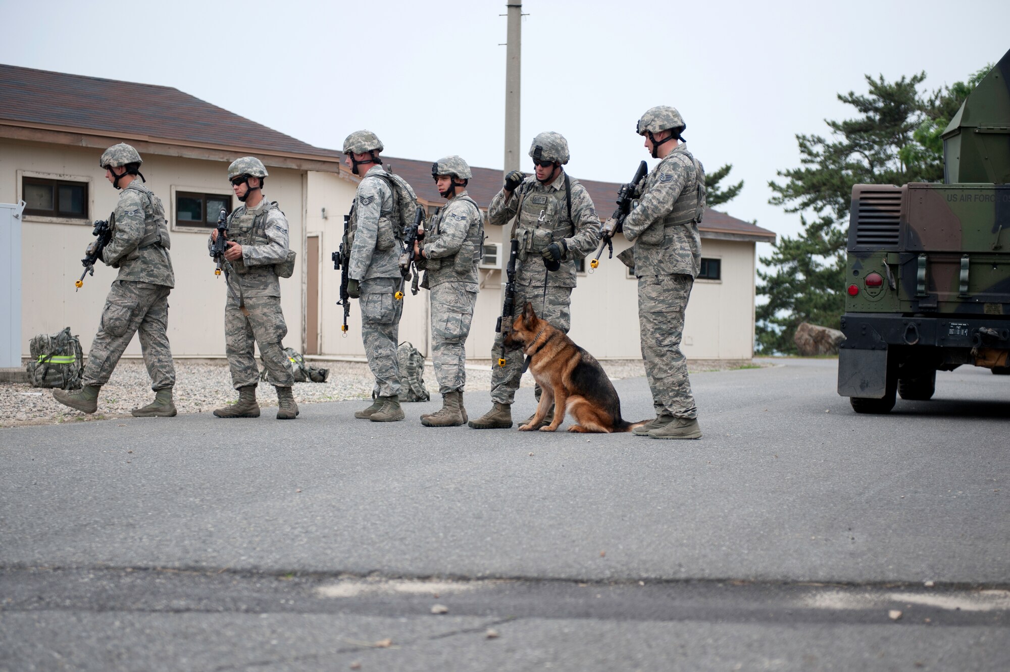 KUNSAN AIR BASE, Republic of Korea – Members of the 8th Security Forces Squadron prepare for military operations urban terrain (MOUT) training at Wolf Pack Park at Kunsan Air Base, ROK June 27, 2013. The event was part of a three-day Combat Readiness Training exercise, which prepares 8th SFS Airmen to “defend the base” in a contingency environment. (U.S. Air Force photo by Staff Sgt. Tong Duong)