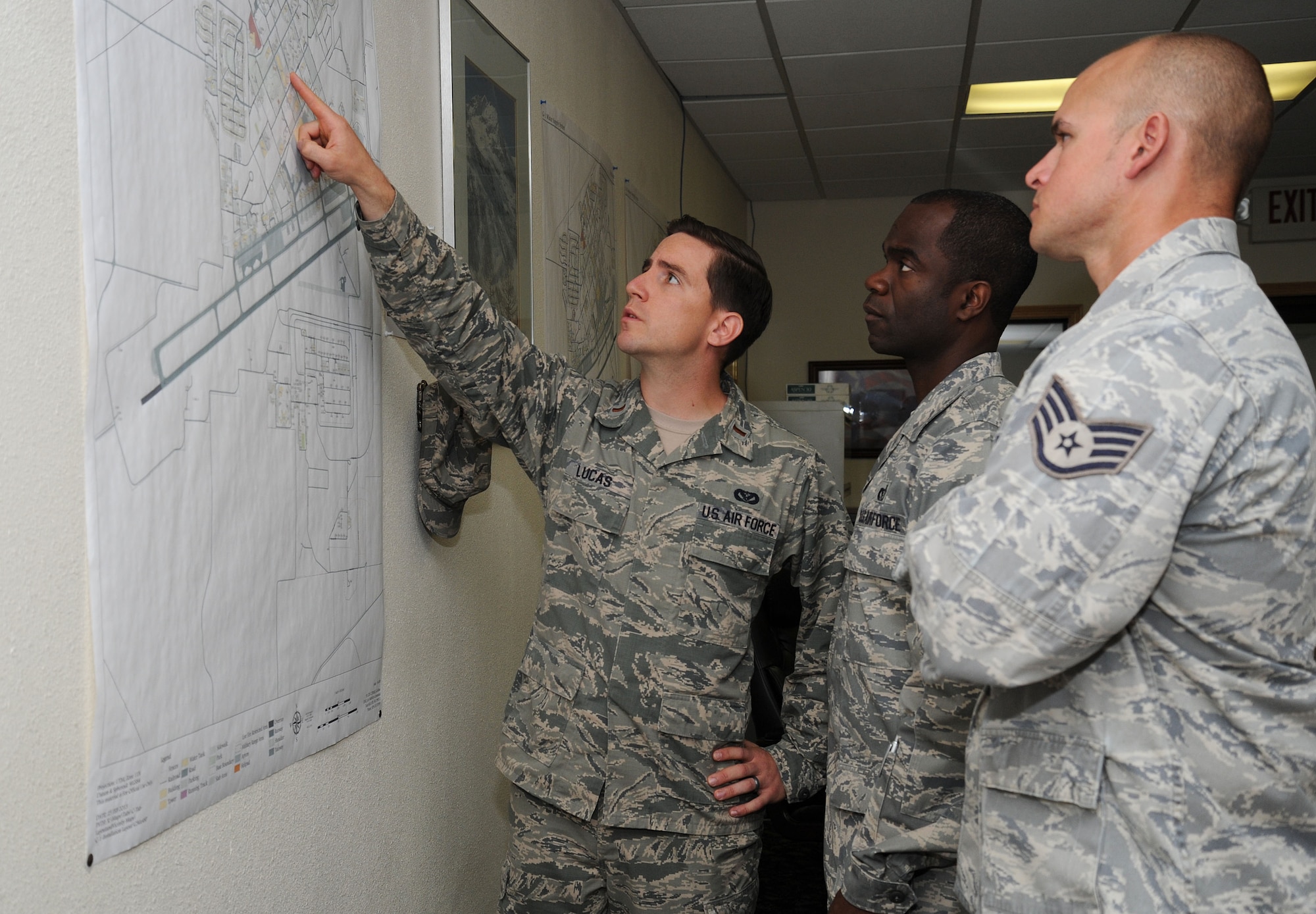 2nd Lt. Trent Lucas, 92nd Civil Engineer Squadron requirements and optimization officer in charge, discusses the CE requirements for the buildings at Fairchild Air Force Base, Wash., July 8, 2013. The CES had undergone a transformation to improve the way the Air Force provides infrastructure support to the weapon system platforms while meeting today's fiscal challenges. (U.S. Air Force photo by Airman 1st Class Janelle Patiño/Released)