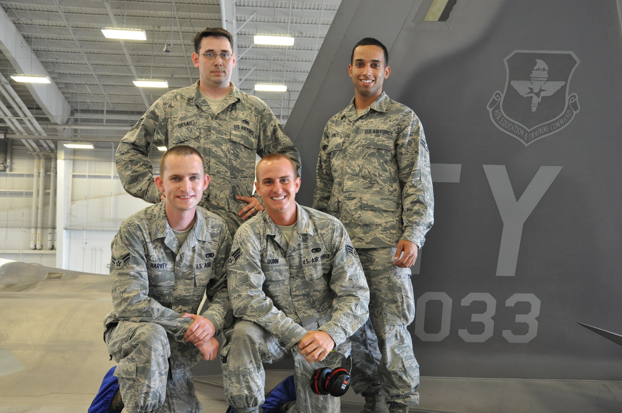 Tech. Sgt. Kraig Callais, 43rd Aircraft Maintenance Unit avionics fleet health manager; Senior Airman Christopher Dunn, 43rd AMU F-22 specialist; Airman 1st Class Kenan Harvey, 43rd AMU F-22 specialist; and Airman 1st Class Daniel Ramize, 43rd AMU F-22 specialist, pose on top of an F-22 Raptor that they are currently working on inside the hangar of the 43rd AMU at Tyndall Air Force Base, Fla. This is part of the Avionics Health of the Fleet program, which was implemented to increase the number of fully mission capable F-22s on Tyndall’s flight line. (U.S. Air Force photo by Airman 1st Class Alex Echols)