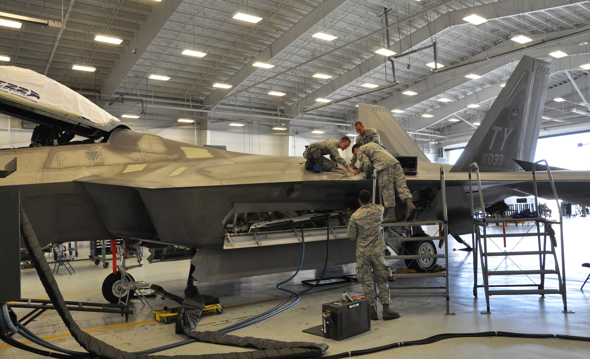Tech. Sgt. Kraig Callais, 43rd Aircraft Maintenance Unit avionics fleet health manager; Senior Airman Christopher Dunn, 43rd AMU F-22 specialist; Airman 1st Class Kenan Harvey, 43rd AMU F-22 specialist; and Airman 1st Class Daniel Ramize, 43rd AMU F-22 specialist, address an issue on an F-22 Raptor as part of Avionics Health of the Fleet inside the hangar of the 43rd AMU at Tyndall Air Force Base, Fla. AVHOF is a program implemented to increase the number of fully mission capable F-22s on Tyndall’s flight line. (U.S. Air Force photo by Airman 1st Class Alex Echols)