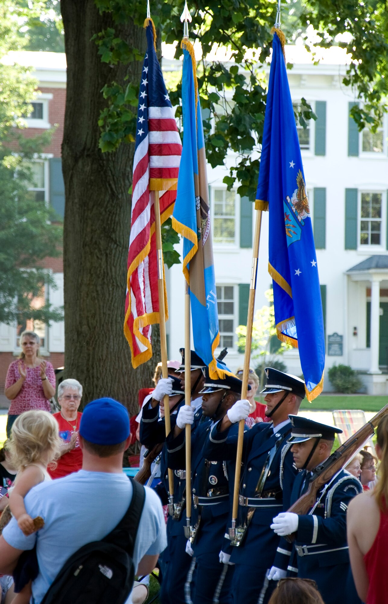 Members of the Dover Air Force Base Honor Guard march as spectators look on during the Independence Day Parade July 4, 2013, in Dover, Del. (U.S. Air Force photo/Senior Airman Jared Duhon)