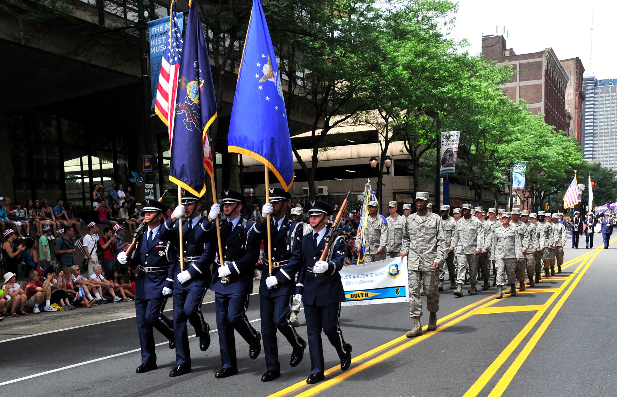 Members of the Dover Air Force Base Honor Guard as well as other Team Dover Airmen march in the WAWA Welcome America Independence Day Parade July 4, 2013, in Philadelphia, Pa. More than 30 members from Dover AFB and units representing all four branches of the military participated in the parade. (U.S. Air Force photo/Tech. Sgt. Chuck Walker)
